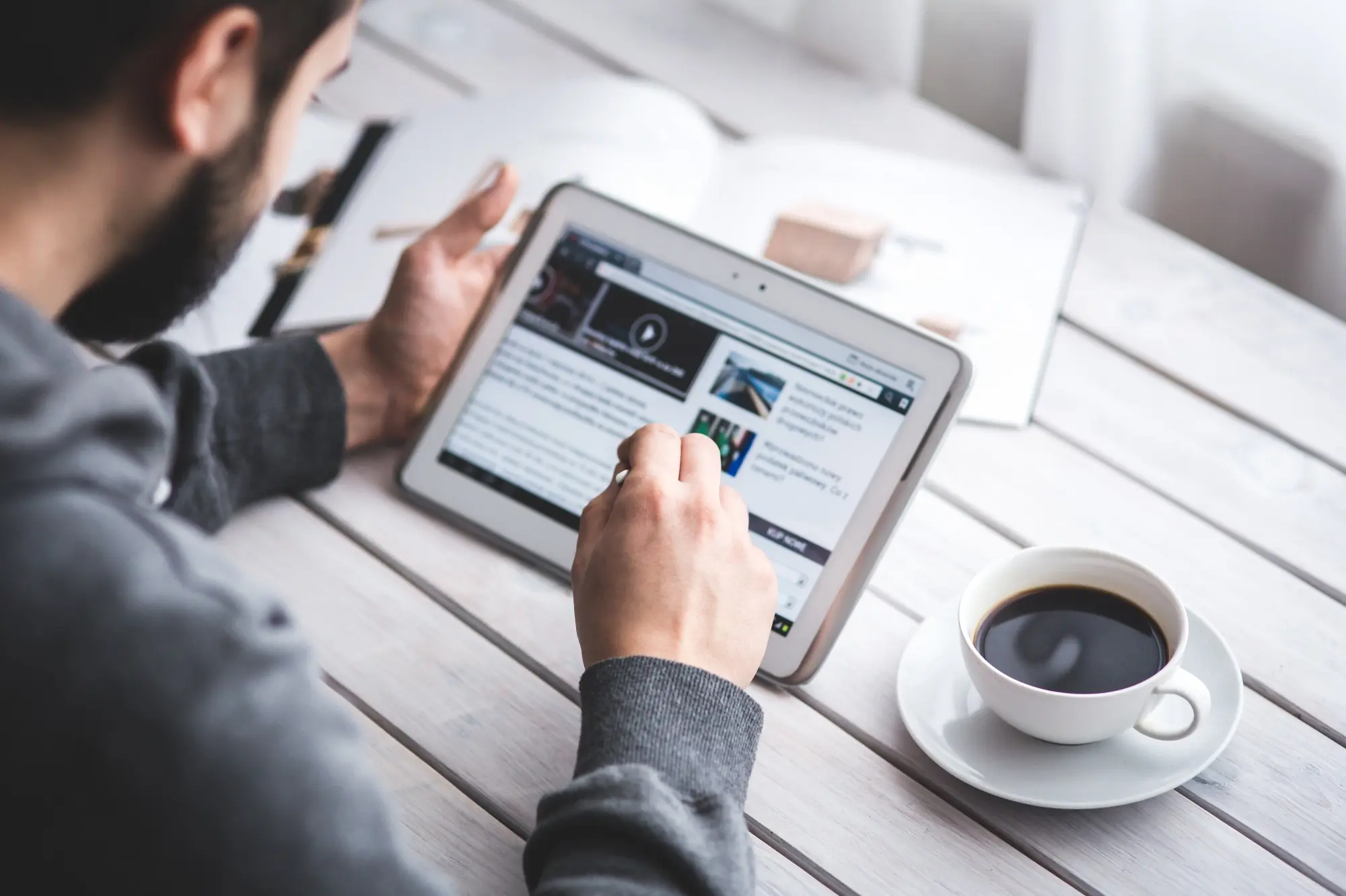 Business professional reading digital content on a tablet
